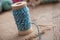 Sewing thread spool bobbin on wooden table background