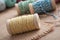 sewing thread spool bobbin on wooden table background