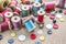 Sewing tools many different colorful thread, needle, many different buttons on wooden background.