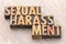 Sexual harassment word abstract in wood type