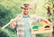 Sexy farmer hold shovel and box with pot. muscular ranch man in cowboy hat. farming and agriculture. Garden equipment