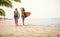 Sexy female surfers enjoy a beach