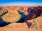 Sexy girl admires panorama of Horseshoe Bend, Page Arizona, The Colorado River