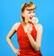 Sexy girl with fashion hairstyle eating lollipop. Beautiful woman with candy.