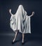 Sexy Girl with long legs in costume Spooky white ghost. Halloween minimal concept