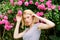 Sexy girl on pink rose background. summer and spring park nature. rose flower smell. Parfume. natural beauty. Spa and