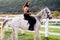 Sexy man on horse. Young jockey training his horse for a ride. Good looking, hunky cowboy rides horse at beautiful