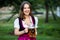 Sexy russian woman in Bavarian dress holding beer mugs.