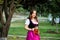 Sexy russian woman in Bavarian dress holding beer mugs.