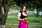 Sexy russian woman in Bavarian dress holding beer mugs.