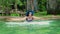 Sexy sllim girl in a blue swimsuit, hat and sunglasses swimming in the thermal pool on a sunny day. Slow motion Young