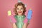 Sexy smiling housekeeper in uniform with clean spray, sponge. Pinup woman hold soup bottle, sponge. Cleanup, cleaning