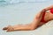 Sexy Suntan Bikin Woman Legs Relaxing Lying Down near Beach.  Beauty Skincare.