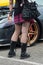 Sexy tattoo girl with mini plaid skirt, fishnet stockings and boots and  at fun car show event