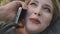 Sexy woman plus size speak mobile closeup. Body positive model talk phone at park. Nature landscape