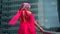 Sexy woman in red dress is walking in city, closeup of legs going up over stair