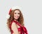 Sexy woman in red silky swimsuit and Santa hat on white, Christmas gift concept