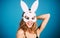 Sexy woman in white mask Easter bunny. Smiling girl in rabbit mask.