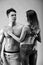 Sexynaked couple of muscular boy in underwear and girl undressing