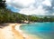 Seychelles Beach with clouds and clear water