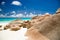 Seychelles beach with granite rocks, sandy beach, blue water