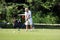 Seychelles, La Digue Island : golf courses in the seychelles, man kicks the ball with a golf club