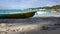 Seychelles. Praslin Island. Beautiful view of the stony coast of the island located in the Indian Ocean. Boat in the