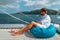 Seychelles, young men on vacation with sailing boat at the Seychelles tropical island