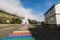 SEYDISFJORDUR, ICELAND - AUGUST 2018: wide angle lens shot of town main street with the view of Seydisfjardarkirkja