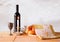 Shabbat image. challah bread, shabbat wine and candelas on wooden table.