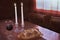 Shabbat Observance At Sunset: Challah, Glass of Wine, Two Lit Candles