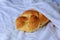 Shabbat or Sabbath kiddush ceremony composition with a traditional sweet fresh loaf of challah bread on a vintage