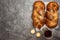 Shabbat Shalom - challah bread, shabbat wine and candles on grey background. Top view. With copy space