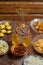 Shabbat table for a family meal with traditional holiday dishes on the table, rosary and menorah