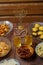 Shabbat table for a family meal with traditional holiday dishes on the table, rosary and menorah