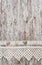 Shabby chic background with seashells and lace fabric on old woo