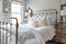 shabby chic bedroom with brass bed, wooden nightstands and white shams