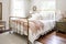shabby chic bedroom with brass bed, wooden nightstands and white shams