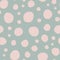 Shabby chic irregular polka dots vector seamless pattern. Trendy seamless pattern with pink dots on light green background. Vector