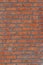 Shabby chic old red brick wall with attractive weathered patina