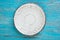 Shabby plate on wood background