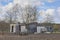 Shabby shack in a field with bare trees in the flemish countryside