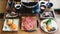 Shabu set including rare slices Wagyu A5 beef, Shabu shoyu and clear base, salmon and vegetables