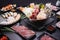 Shabu Shabu or Sukiyaki, a popular dish of pork, beef, shrimp, squid, seafood and fresh vegetables. Placed on a table with a