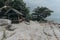 A shack on the beach with beautiful rocks and shady trees for tourism campaigns, vacation spots and design needs