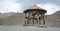 A shack with many praying flags