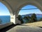 In the shade of the arcades of a small church with a view