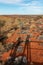 Shade of two tourists taking pictures of mount Uluru, aboriginal sacred landmark in central Australia, Northern Territory NT,