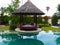 Shaded area near an infinity pool with towel swans