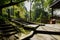 Shaded mountainside stone steps before gazebo in sunny winter